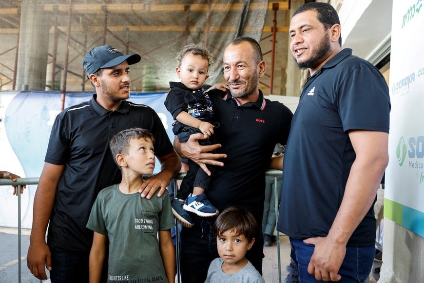 The brother and sons of Qaid Farhan Alkadi, a Bedouin Israeli hostage who was kidnapped during the deadly October 7 attack, pose after Alkadi was rescued by Israeli forces, at Soroka Medical Center in Beersheba, Israel, August 27, 2024. REUTERS/Amir Cohen