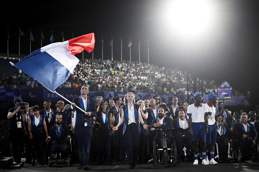 Paris 2024 Paralympics - Opening Ceremony - Paris, France - August 28, 2024 
France's paralympic flag bearers Nantenin Keita and Alexis Hanquinquant lead the France's delegation during the Parade of Nations, as part of the Paris 2024 Paralympic Games Opening Ceremony at the Place de la Concorde  Julien De Rosa/Pool via REUTERS