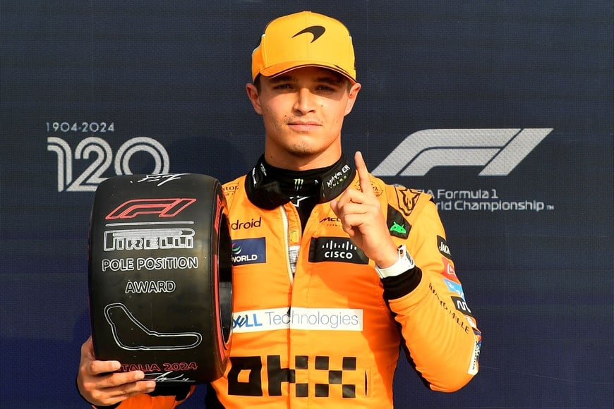 Formula One F1 - Italian Grand Prix - Autodromo Nazionale Monza, Monza, Italy - August 31, 2024
McLaren's Lando Norris poses with a trophy after qualifying in pole position Massimo Pinca/Pool via REUTERS