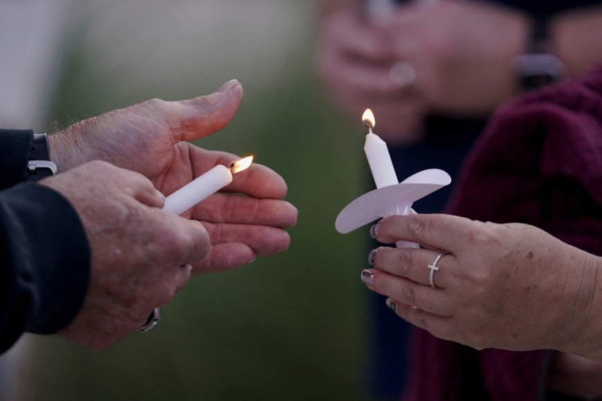 People light candles while attending a vigil at Jug Tavern Park following a shooting at Apalachee High School in Winder, Georgia, U.S. September 4, 2024. REUTERS/Elijah Nouvelage