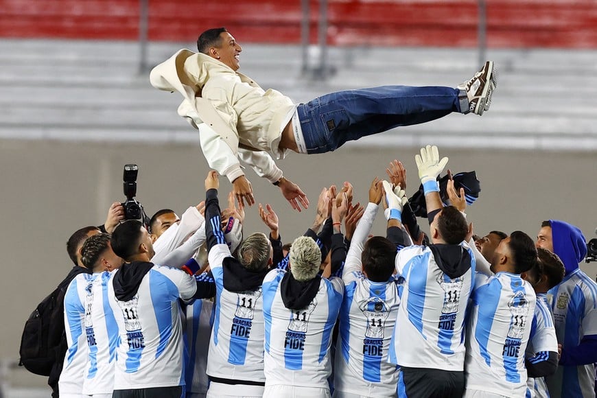 Soccer Football - World Cup - South American Qualifiers - Argentina v Chile - Estadio Mas Monumental, Buenos Aires, Argentina - September 5, 2024
Argentina's Angel Di Maria is tossed by teammates during his tribute before the match REUTERS/Agustin Marcarian