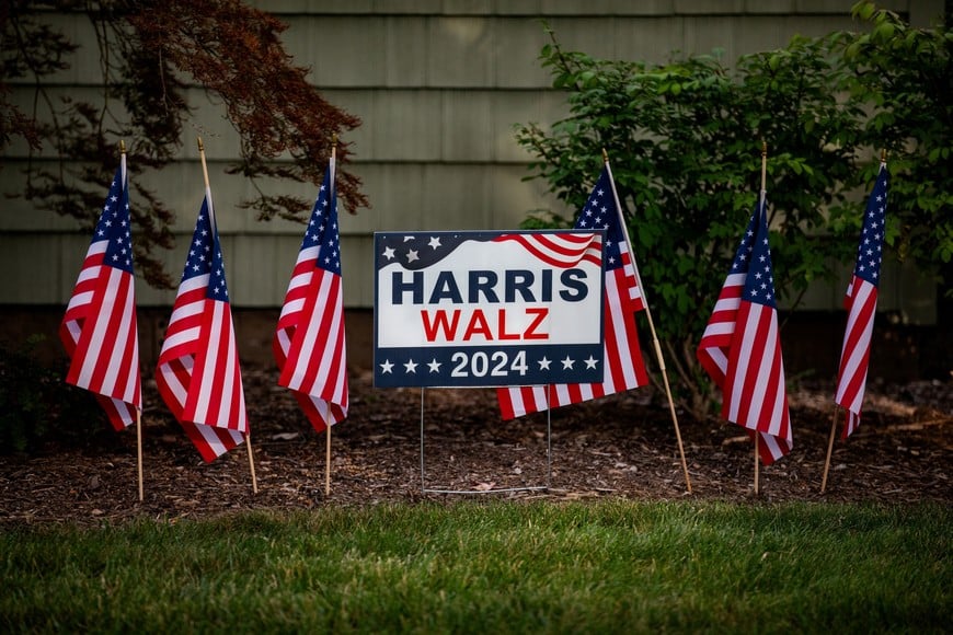 A lawn sign surrounded by American flags in support of U.S. Vice President and Democratic presidential nominee Kamala Harris in Berkley, Michigan, U.S. September 5, 2024. REUTERS/Emily Elconin