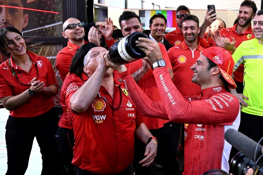 Formula One F1 - Australian Grand Prix - Melbourne Grand Prix Circuit, Melbourne, Australia - March 24, 2024
Ferrari's Carlos Sainz Jr. celebrates with team principal Frederic Vasseur after winning the Australian Grand Prix REUTERS/Jaimi Joy