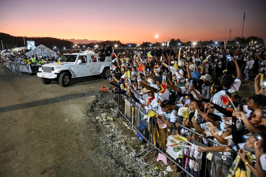 Pope Francis waves from the popemobile at the end of a mass at the Esplanade of Tasitolu, in Dili, East Timor September 10, 2024. ALESSANDRO DI MEO/Pool via REUTERS