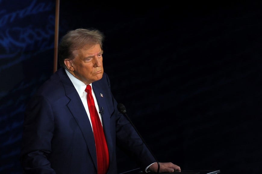 Republican presidential nominee, former U.S. President Donald Trump listens during a presidential debate hosted by ABC with Democratic presidential nominee, U.S. Vice President Kamala Harris, in Philadelphia, Pennsylvania, U.S., September 10, 2024. REUTERS/Brian Snyder