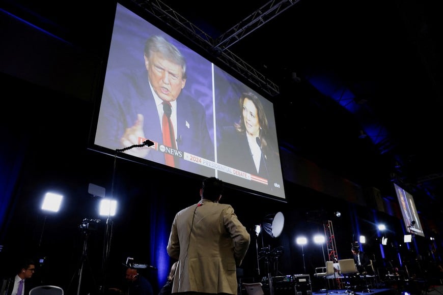 A screen displays the presidential debate hosted by ABC between Republican presidential nominee, former U.S. President Donald Trump and Democratic presidential nominee, U.S. Vice President Kamala Harris in Philadelphia, Pennsylvania, U.S., September 10, 2024. REUTERS/Evelyn Hockstein