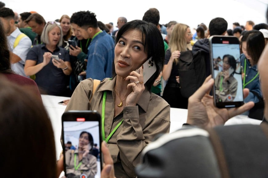 An attendee makes a video with the new iPhone 16 Pro as Apple holds an event at the Steve Jobs Theater on its campus in Cupertino, California, U.S. September 9, 2024. REUTERS/Manuel Orbegozo     TPX IMAGES OF THE DAY