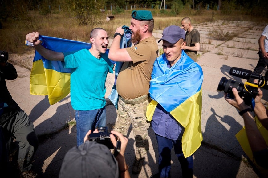 Ukrainian prisoners of war (POWs) react after a swap, amid Russia's attack on Ukraine, at an unknown location in Ukraine, in this handout picture released on September 14, 2024. Ukrainian Presidential Press Service/Handout via REUTERS ATTENTION EDITORS - THIS IMAGE HAS BEEN SUPPLIED BY A THIRD PARTY.