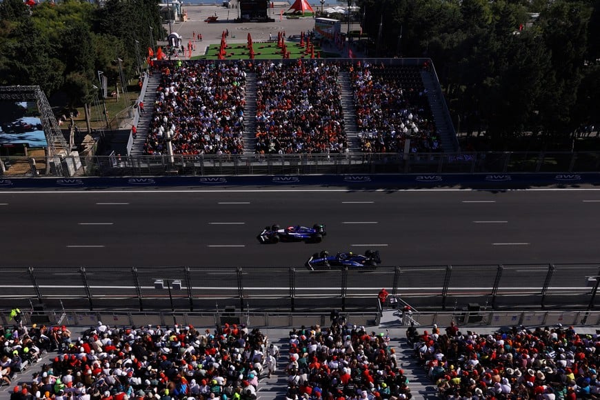 Formula One F1 - Azerbaijan Grand Prix - Baku City Circuit, Baku, Azerbaijan - September 15, 2024
RB's Daniel Ricciardo and Williams' Franco Colapinto in action during the race REUTERS/Hannah Mckay