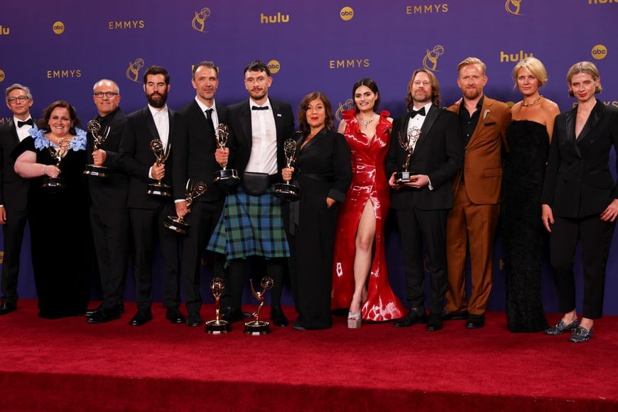 Jessica Gunning, winner of the Outstanding Supporting Actress In A Limited Or Anthology Series Or Movie award, and Richard Gadd, winner of the Outstanding Lead Actor in a Limited or Anthology Series or Movie and the Outstanding Writing For A Limited Or Anthology Series Or Movie awards for "Baby Reindeer", which was awarded with the Emmy for Outstanding Limited or Anthology Series, pose with Tom Goodman-Hill, Nava Mau and members of cast and crew at the 76th Primetime Emmy Awards in Los Angeles, California, U.S., September 15, 2024. REUTERS/Mike Blake