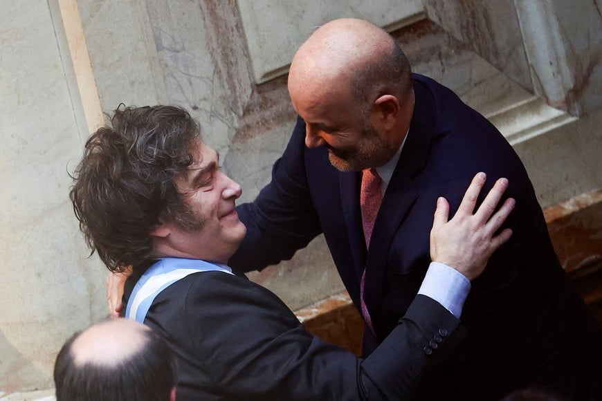 Argentine President Javier Milei greets Deregulation and State Transformation Minister Federico Sturzenegger on the day he presents the fiscal year 2025 budget, at the National Congress in Buenos Aires, Argentina, September 15, 2024. REUTERS/Agustin Marcarian