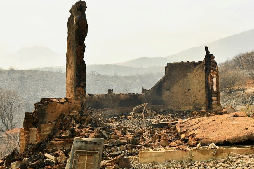 The remains of a house are seen after a wildfire in Capilla del Monte, in the province of Cordoba, Argentina September 20, 2024. REUTERS/Charly Soto NO RESALES. NO ARCHIVES