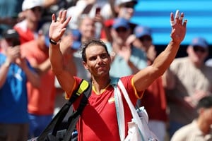 Paris 2024 Olympics - Tennis - Men's Singles Second Round - Roland-Garros Stadium, Paris, France - July 29, 2024.
Rafael Nadal of Spain waves after losing his match against Novak Djokovic of Serbia. REUTERS/Violeta Santos Moura     TPX IMAGES OF THE DAY