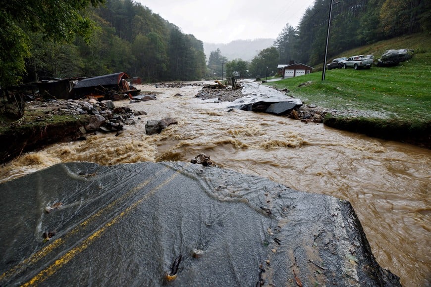 The Laurel Fork Road bridge sits destroyed from flood waters raging in the Upper Laurel Fork creek after Tropical Storm Helene struck, in Vilas, North Carolina, U.S. September 27, 2024.  REUTERS/Jonathan Drake