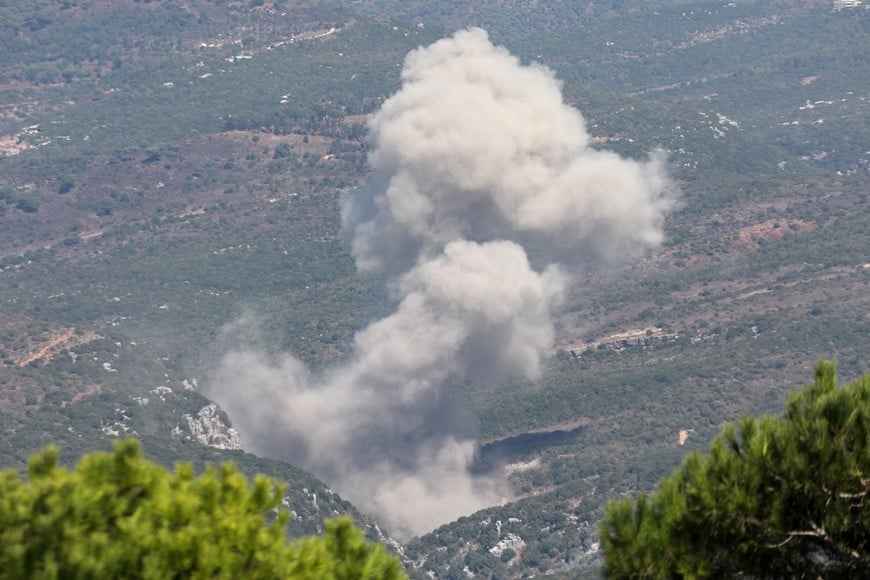 Smoke billows over southern Lebanon, amid ongoing cross-border hostilities between Hezbollah and Israeli forces, as pictured from Marjayoun, near the border with Israel, September 27, 2024. REUTERS/Karamallah Daher