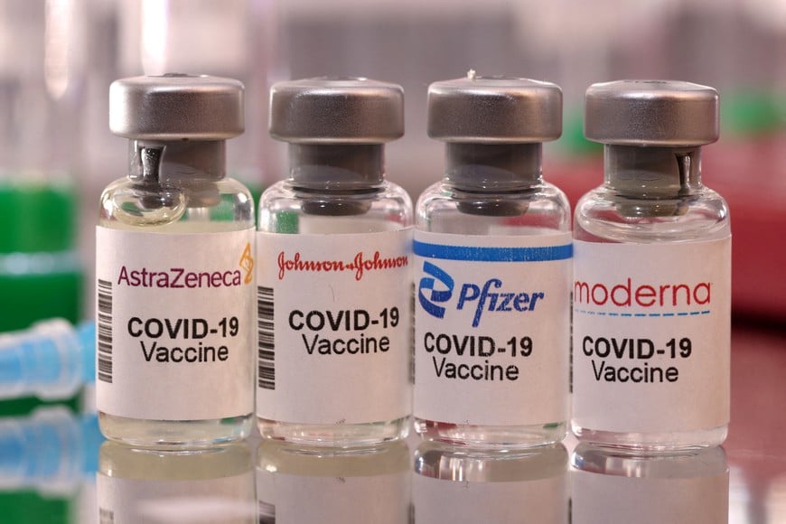 FILE PHOTO: Vials labelled "AstraZeneca, Johnson & Johnson, Pfizer, Moderna COVID-19 Vaccine" are seen in this illustration taken January 16, 2022. REUTERS/Dado Ruvic/Illustration/File Photo