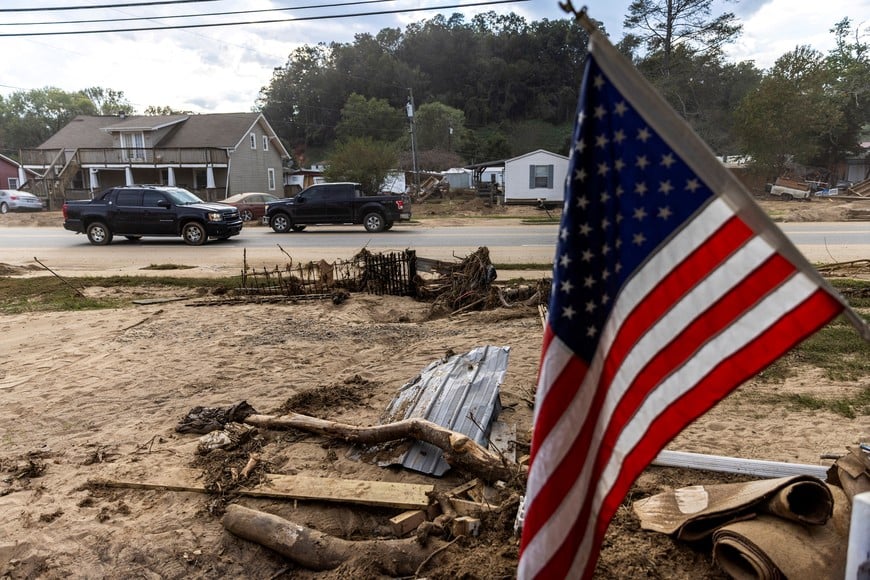 Cars drive along a road affected by floods following the passing of Hurricane Helene in Old Fort, North Carolina, U.S., October 4, 2024.  REUTERS/Eduardo Munoz