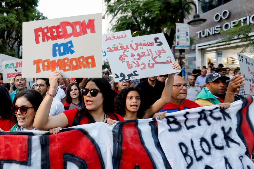 Demonstrators carry a banner during a protest against Tunisia's President Kais Saied, two days before the presidential election, in Tunis, Tunisia October 4, 2024. REUTERS/Zoubeir Souissi