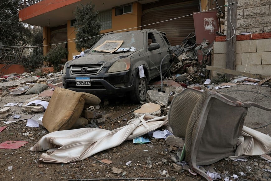 A view shows a damaged car in the aftermath of Israeli strikes, amid the ongoing hostilities between Hezbollah and Israeli forces, in Qmatiyeh, Lebanon, October 7, 2024. REUTERS/Mohamed Azakir