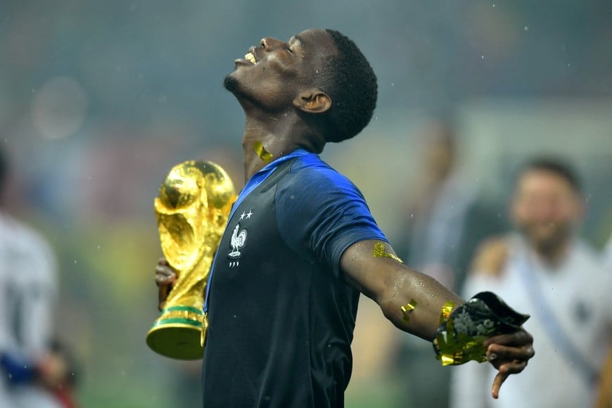 FILE PHOTO: Soccer Football - World Cup - Final - France v Croatia - Luzhniki Stadium, Moscow, Russia - July 15, 2018  France's Paul Pogba holds the trophy as he celebrates winning the World Cup  REUTERS/Dylan Martinez/File Photo