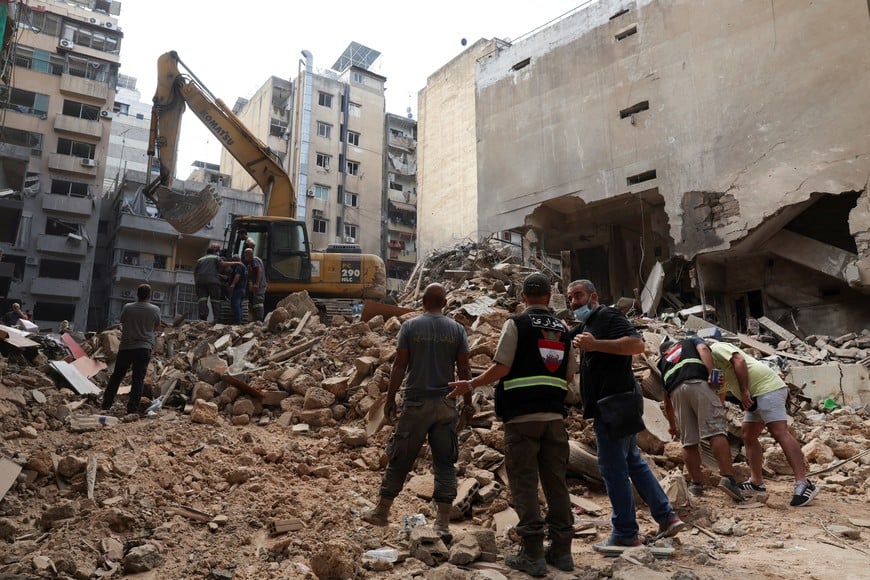 A machinery clears rubble at a site of an Israeli strike, amid ongoing hostilities between Hezbollah and Israeli forces, in Beirut, Lebanon, October 12, 2024. REUTERS/Emilie Madi