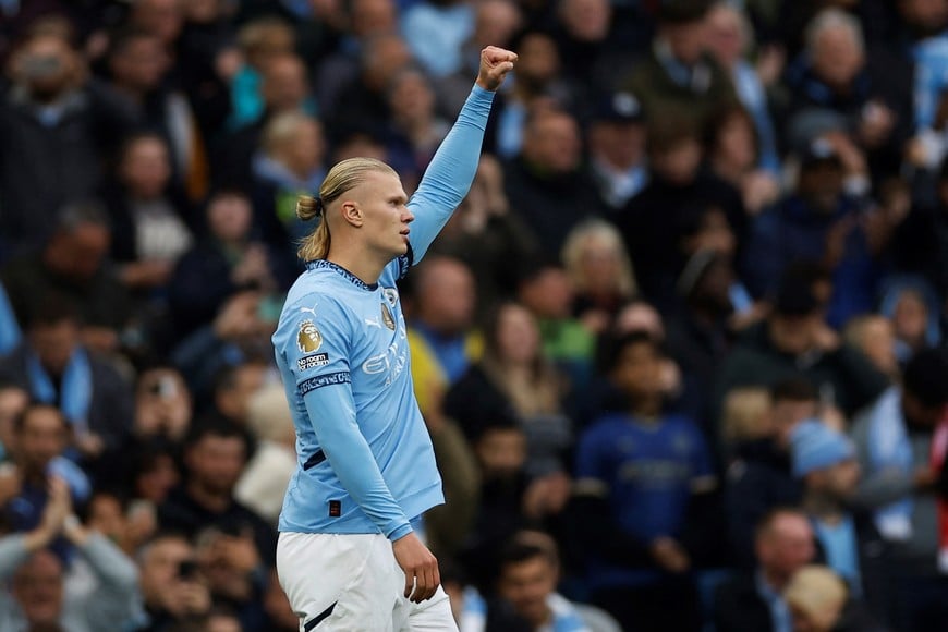 Soccer Football - Premier League - Manchester City v Arsenal - Etihad Stadium, Manchester, Britain - September 22, 2024
Manchester City's Erling Haaland celebrates scoring their first goal Action Images via Reuters/Jason Cairnduff EDITORIAL USE ONLY. NO USE WITH UNAUTHORIZED AUDIO, VIDEO, DATA, FIXTURE LISTS, CLUB/LEAGUE LOGOS OR 'LIVE' SERVICES. ONLINE IN-MATCH USE LIMITED TO 120 IMAGES, NO VIDEO EMULATION. NO USE IN BETTING, GAMES OR SINGLE CLUB/LEAGUE/PLAYER PUBLICATIONS. PLEASE CONTACT YOUR ACCOUNT REPRESENTATIVE FOR FURTHER DETAILS..