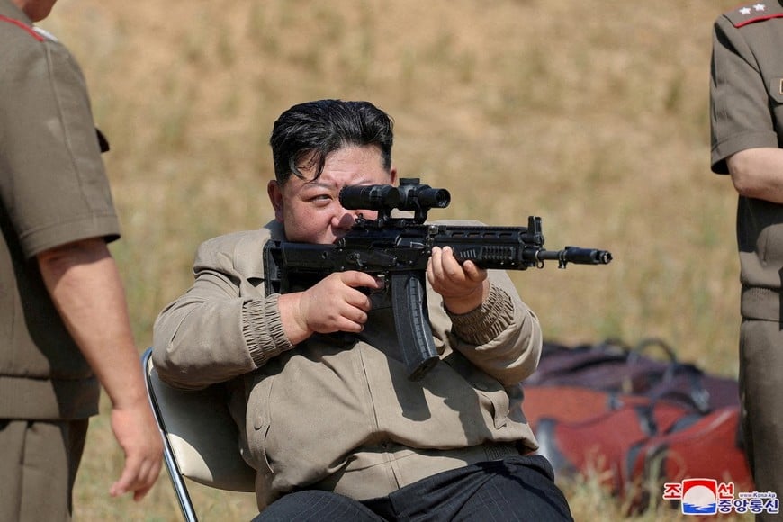 North Korean leader Kim Jong Un aims a weapon as he visits the training base of the special operations armed force of North Korea's army at an undisclosed location in North Korea, September 11, 2024 in this photo released by North Korea's official Korean Central News Agency.    KCNA via REUTERS    ATTENTION EDITORS - THIS IMAGE WAS PROVIDED BY A THIRD PARTY. REUTERS IS UNABLE TO INDEPENDENTLY VERIFY THIS IMAGE. NO THIRD PARTY SALES. SOUTH KOREA OUT. NO COMMERCIAL OR EDITORIAL SALES IN SOUTH KOREA.     TPX IMAGES OF THE DAY