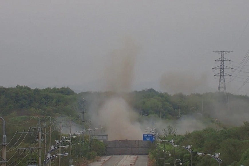 Smoke rises after North Korea blows up sections of inter-Korean roads on its side of the border between the two Koreas, according to South Korea's military, as seen from the South Korean side, October 15, 2024, in this screen grab from a handout video. South Korean Defence Ministry/Handout via REUTERS    THIS IMAGE HAS BEEN SUPPLIED BY A THIRD PARTY