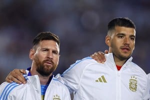 Soccer Football - World Cup - South American Qualifiers - Argentina v Bolivia - Estadio Mas Monumental, Buenos Aires, Argentina - October 15, 2024
Argentina's Lionel Messi and Geronimo Rulli line up during the national anthems before the match REUTERS/Agustin Marcarian