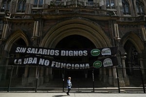 A woman walks past an empty faculty during a university strike following the ratification of the Argentine President Milei's veto of university funding law, in Buenos Aires, Argentina, October 10, 2024. REUTERS/Pedro Lazaro Fernandez