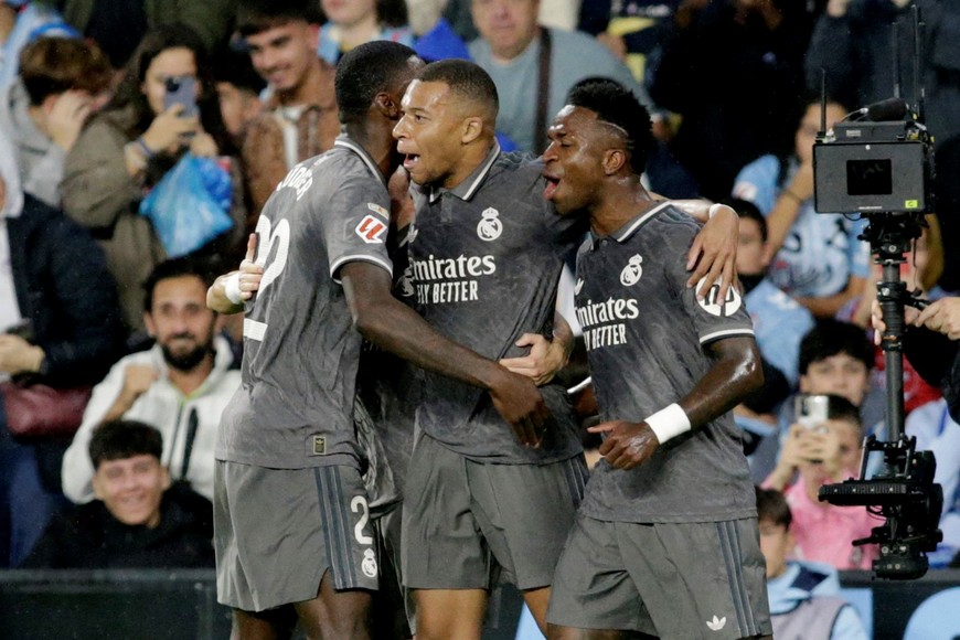 Soccer Football - LaLiga - Celta Vigo v Real Madrid - Estadio de Balaidos, Vigo, Spain - October 19, 2024
Real Madrid's Kylian Mbappe celebrates scoring their first goal with Fran Garcia, Antonio Rudiger and Vinicius Junior REUTERS/Miguel Vidal