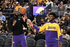 Oct 15, 2024; Las Vegas, Nevada, USA; Los Angeles Lakers forward LeBron James (23) warms up with guard Bronny James (9) before the preseason game against the Golden State Warriors at T-Mobile Arena. Mandatory Credit: Candice Ward-Imagn Images