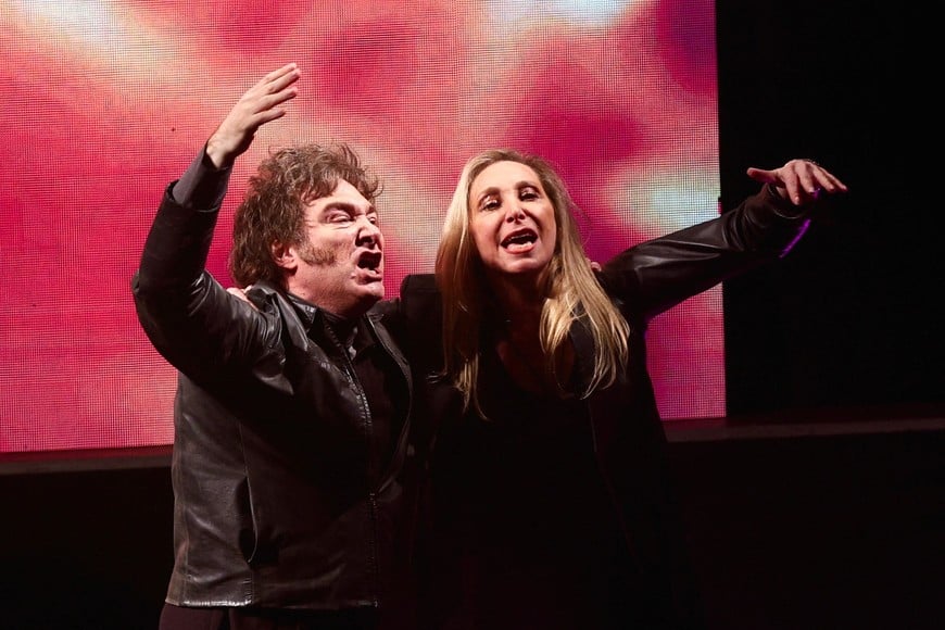 Argentine President Javier Milei and his sister Karina Milei gesture onstage during a rally to launch his party, La Libertad Avanza, nationally, in Buenos Aires, Argentina September 28, 2024.  REUTERS/Matias Baglietto