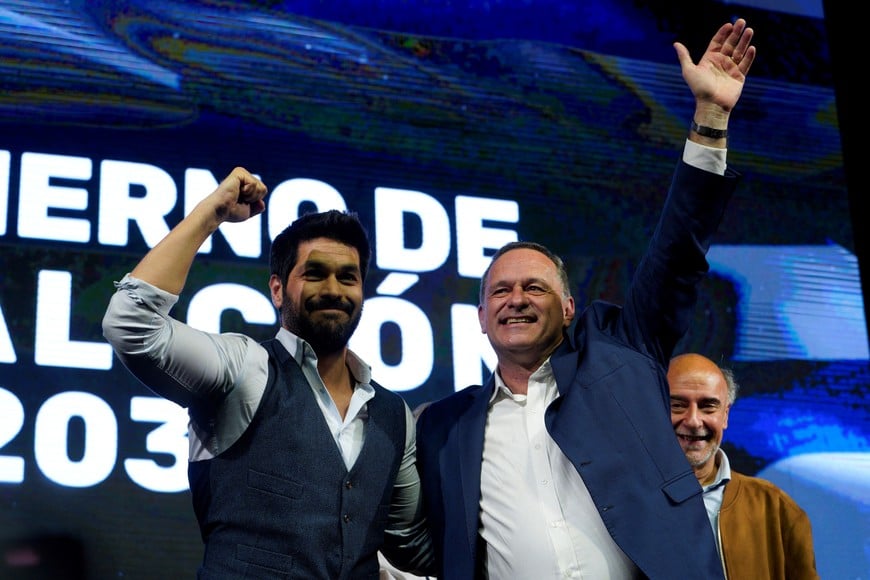 National Party presidential candidate Alvaro Delgado and Colorado Party presidential candidate Andres Ojeda acknowledge supporters following the first exit polls during the general election, in Montevideo, Uruguay October 27, 2024. REUTERS/Andres Cuenca