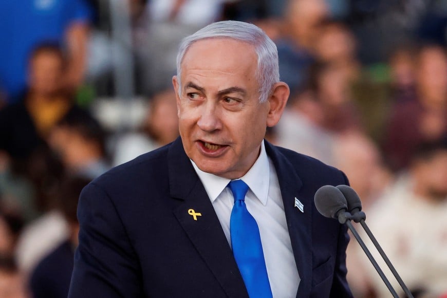 Israeli Prime Minister Benjamin Netanyahu speaks as he attends a ceremony for the 70th cohort of military combat officers, at an army base near Mitzpe Ramon, Israel, October 31, 2024. REUTERS/Amir Cohen