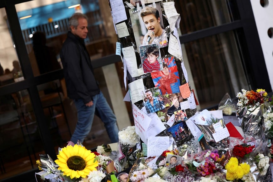 Tributes are left outside the hotel where Liam Payne, former One Direction band member, was found dead after he fell from a third-floor hotel room balcony, in Buenos Aires, Argentina, October 18, 2024. REUTERS/Agustin Marcarian