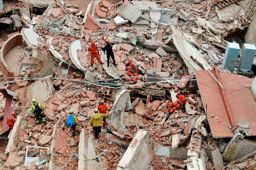 A drone view shows rescue workers searching for victims amidst the remains of the hotel Dubrovnik, after it collapsed, in the coastal city of Villa Gesell, Buenos Aires, Argentina October 29, 2024. REUTERS/Pablo Funes