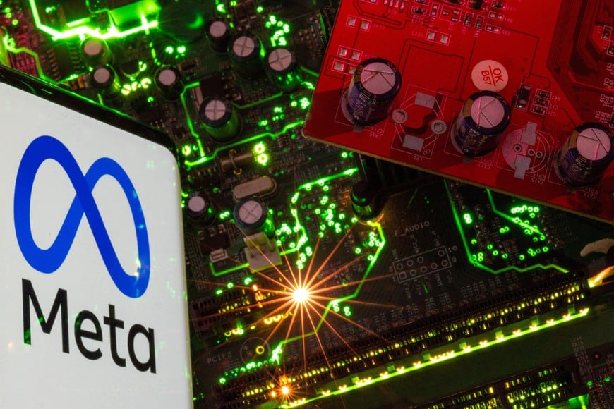 A smartphone with a displayed Meta logo is placed on a computer motherboard in this illustration taken February 23, 2023. REUTERS/Dado Ruvic/Illustration