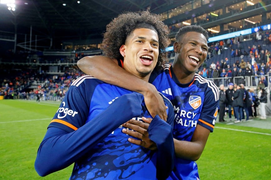 Nov 25, 2023; Cincinnati, Ohio, USA; FC Cincinnati midfielder Marco Angulo (left) and defender Yerson Mosquera (15) celebrate after winning a MLS Cup Eastern Conference Semifinal match against the Philadelphia Union at TQL Stadium. Mandatory Credit: Joseph Maiorana-USA TODAY Sports