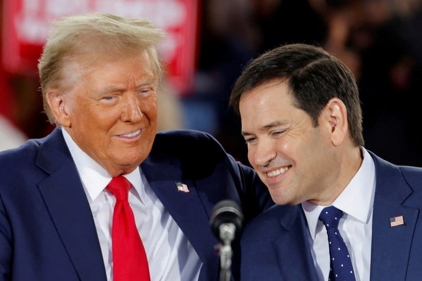 Republican presidential nominee and former U.S. President Donald Trump and Senator Marco Rubio (R-FL) react during a campaign event at Dorton Arena, in Raleigh, North Carolina, U.S. November 4, 2024. REUTERS/Jonathan Drake