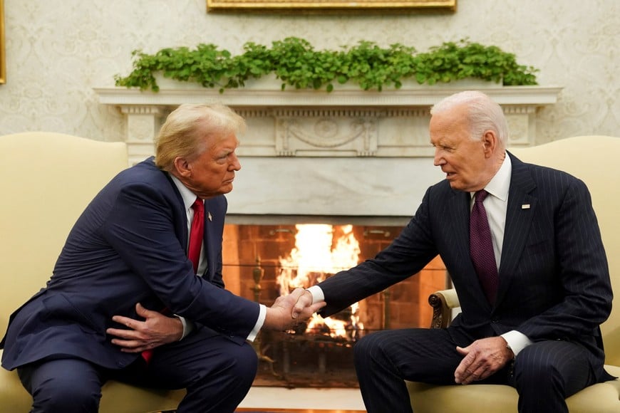 U.S. President Joe Biden meets with President-elect Donald Trump in the Oval Office at the White House in Washington, U.S., November 13, 2024. REUTERS/Kevin Lamarque