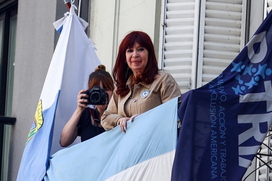 Argentina's former President Cristina Fernandez de Kirchner stands on a balcony, on the day of a hearing at the Federal Court of Criminal Appeals on whether to confirm a prison sentence on charges of alleged corruption in the awarding of public works during her presidency, in Buenos Aires, Argentina November 13, 2024. REUTERS/Matias Baglietto