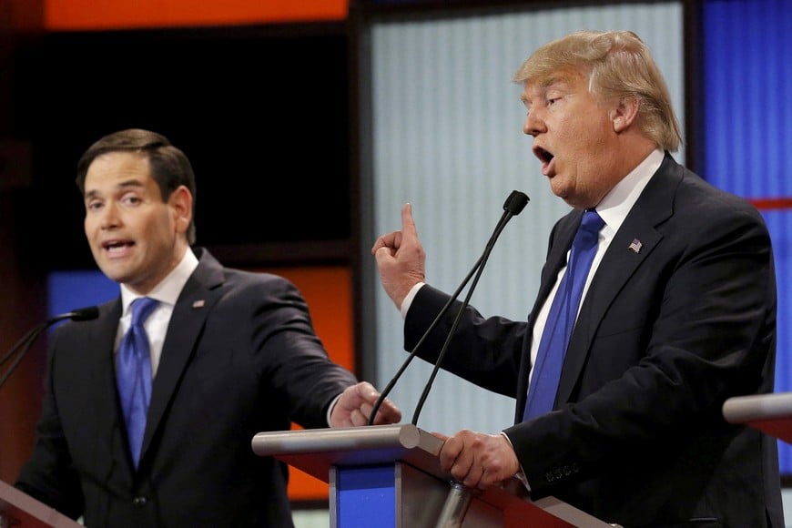 FILE PHOTO: Republican U.S. presidential candidate Marco Rubio and rival candidate Donald Trump (R) speak simultaneously at the U.S. Republican presidential candidates debate in Detroit, Michigan, March 3, 2016. REUTERS/Jim Young/File Photo