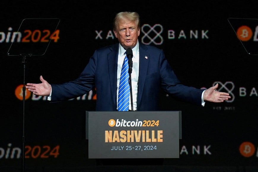 FILE PHOTO: Republican presidential nominee and former U.S. President Donald Trump gestures at the Bitcoin 2024 event in Nashville, Tennessee, U.S., July 27, 2024. REUTERS/Kevin Wurm/File Photo