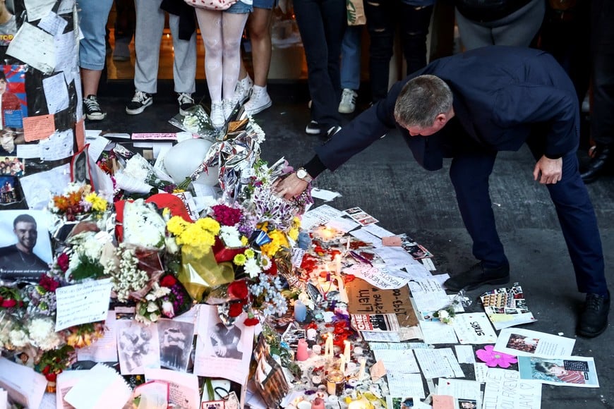 Geoff Payne, father of former One Direction band member Liam Payne, looks at tributes left outside the hotel where Liam Payne was found dead after he fell from a third-floor hotel room balcony, in Buenos Aires, Argentina October 18, 2024. REUTERS/Tomas Cuesta