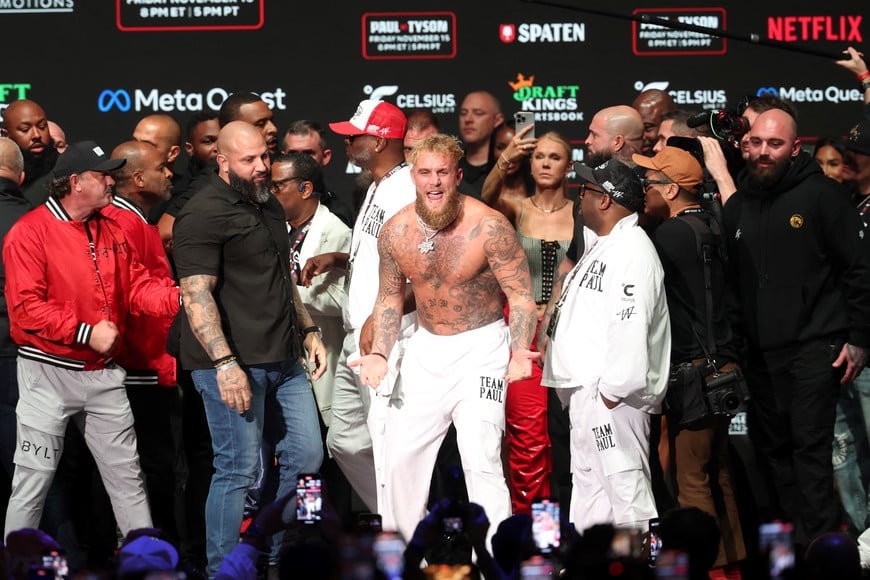 Nov 14, 2024; Irving, TX, USA;  Jake Paul reacts after being slapped by Mike Tyson (not pictured) after weighing in at the Toyota Music Factory.  Mandatory Credit: Kevin Jairaj-Imagn Images