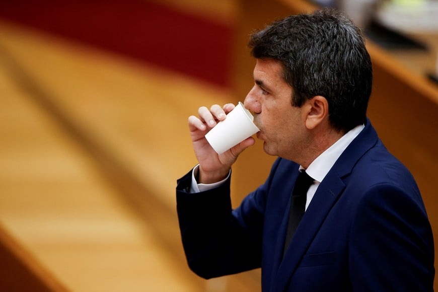 Valencia's regional leader Carlos Mazon drinks as he appears before the regional assembly following the devastating floods on October 29 that claimed over 200 lives, in Valencia, Spain, November 15, 2024. REUTERS/Eva Manez