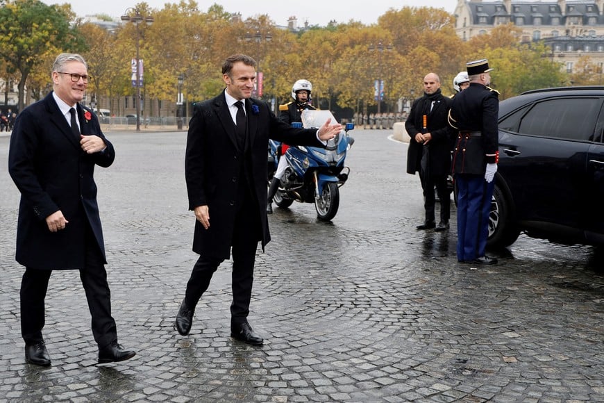 Britain's Prime Minister Keir Starmer and France's President Emmanuel Macron walk during commemorations marking the 106th anniversary of the November 11, 1918, Armistice, ending World War I (WWI), on the Place de l'Etoile in Paris, on November 11, 2024. LUDOVIC MARIN/Pool via REUTERS