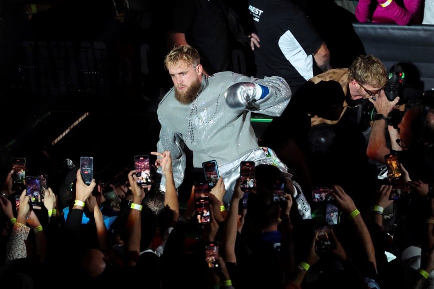 Nov 15, 2024; Arlington, Texas, UNITED STATES;  Jake Paul and his brother Logan ride to the ring in a car before the fight against Mike Tyson at AT&T Stadium. Mandatory Credit: Kevin Jairaj-Imagn Images