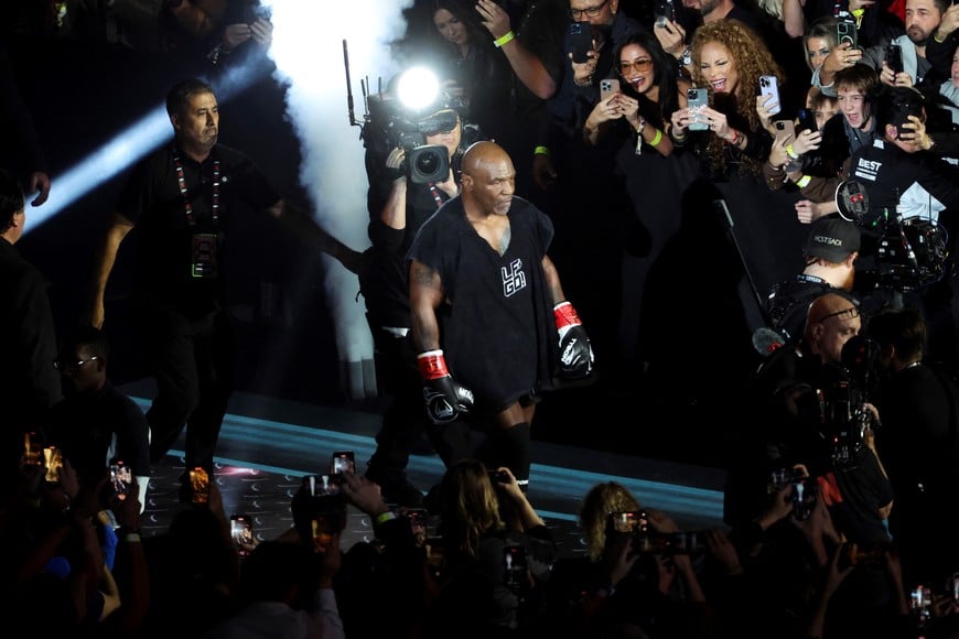 Nov 15, 2024; Arlington, Texas, UNITED STATES;  Mike Tyson walks to the ring before the fight against Jake Paul at AT&T Stadium. Mandatory Credit: Kevin Jairaj-Imagn Images